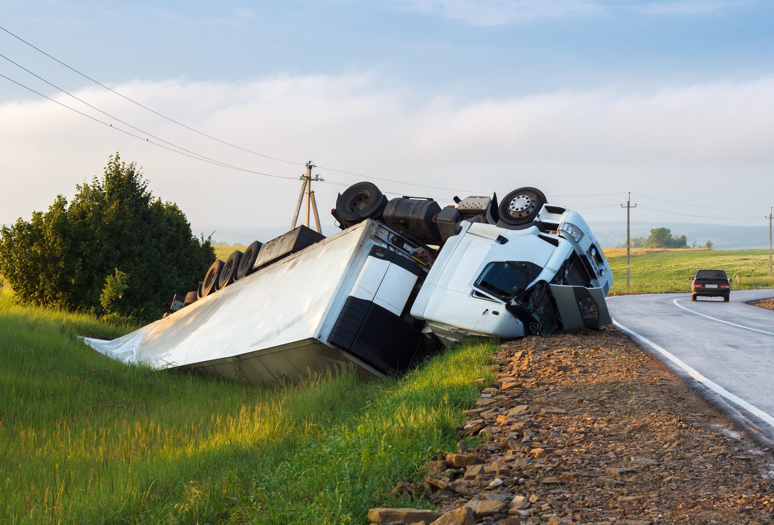 Truck overturn due to overloading resulting to truck accident..