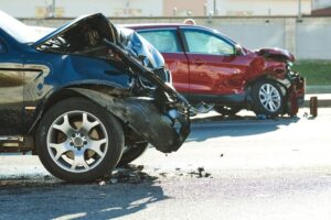 Two cars colliding on the city street