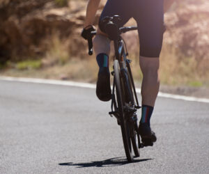 bicycle rider pedaling on the road