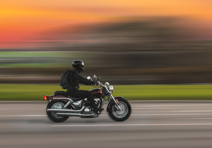 motorcycle rider speeding down the highway