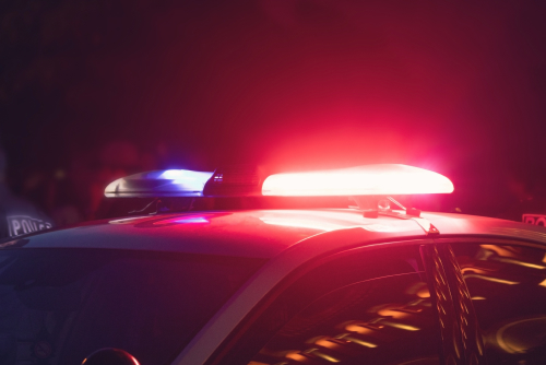 police lights on top of a police cruiser at night