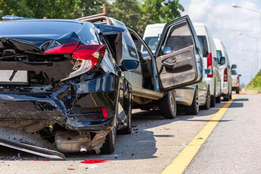 Multiple car collision in the highway.